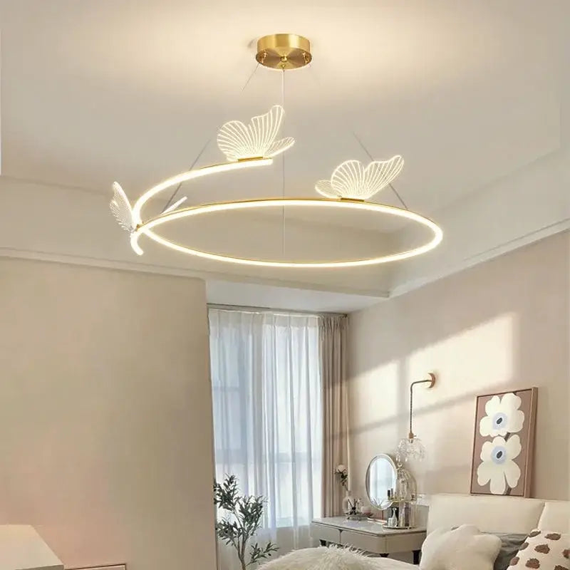 Modern gold ceiling chandelier with a circular led ring and delicate decorbites butterfly design accents for dining room decor