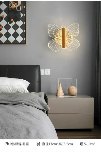 Modern gold butterfly wall lamp with delicate white wireframe wings and warm led light perfect for bedroom decorbites wall lamp