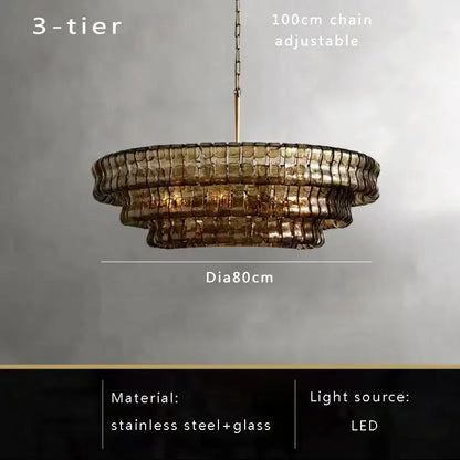Modern gold cascading crystal pendant lights featuring a three-tiered brown glass pendant with stainless steel frame and adjustable chain