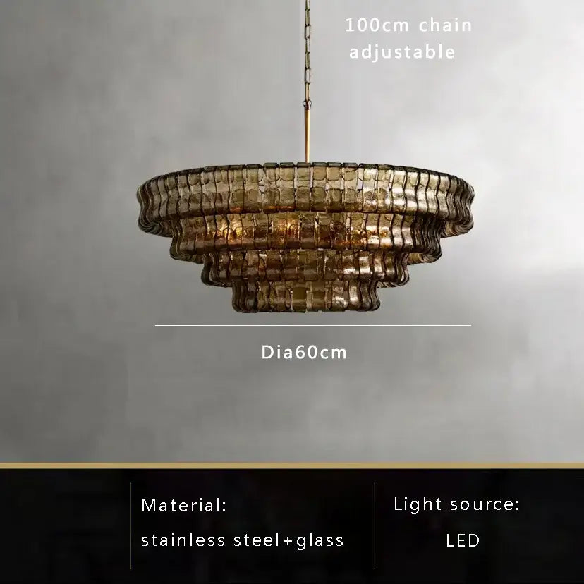 Modern gold cascading crystal pendant lights featuring a tiered amber-tinted brown glass pendant with stainless steel frame