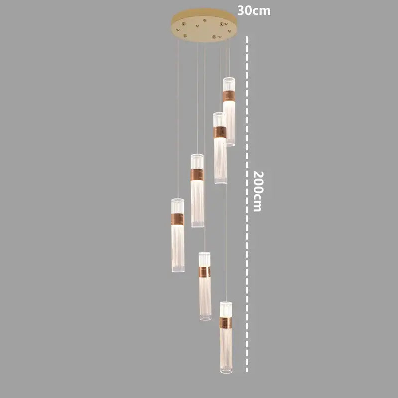 Modern pendant light with copper-accented glass shades and adjustable height design for dining room use