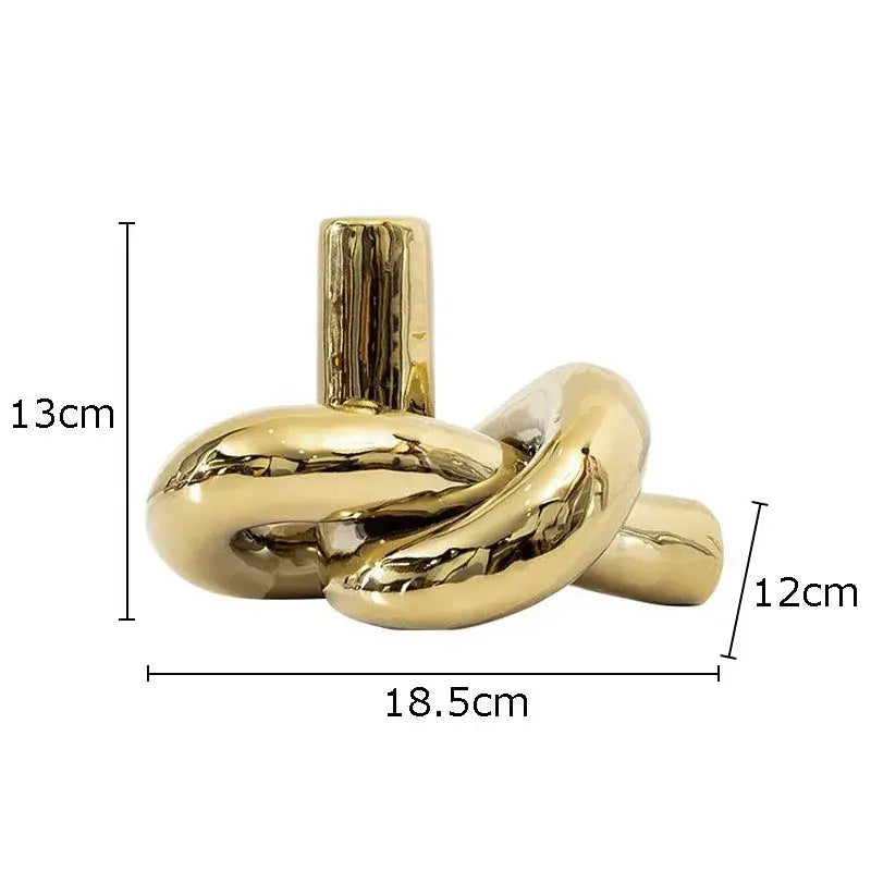 Modern gold ceramic knot sculpture with glossy finish and cylindrical stem for living room decorbites ceramic knot decor