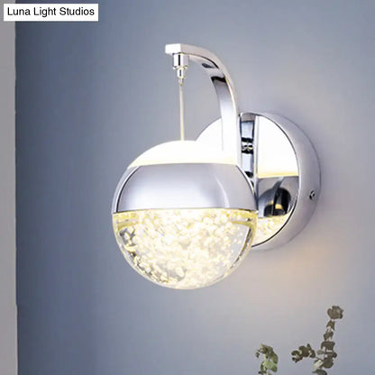Modern gold chrome crystal ball wall light with chrome finish and translucent sparkling lower half for bedroom lighting