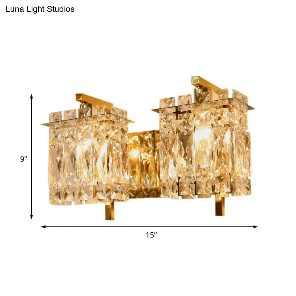 Gold-toned wall light fixture with asymmetrical crystal glass elements compatible with e12 e14 bulb base