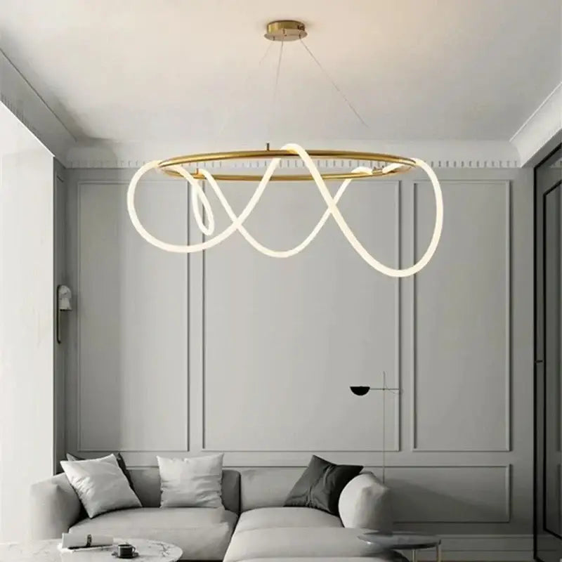 Modern gold circle note linear light bedroom pendant lamp with a gold-toned frame and flowing white led strips by decorbites circle note
