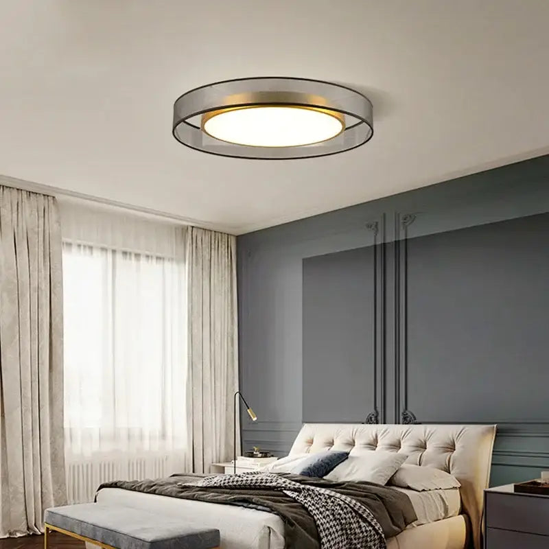 Modern gold circular led ceiling light with sleek metallic frame and warm glowing center for bedroom decorbites circular led