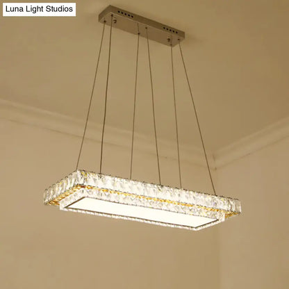 DecorBites modern LED suspension light featuring clear crystal blocks and a sleek metallic frame for dining rooms