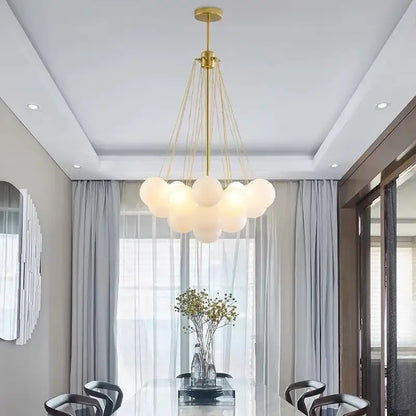 Modern gold cloud glass ball led chandelier with frosted glass globe shades suspended by thin cords for dining room decorbites glass ball