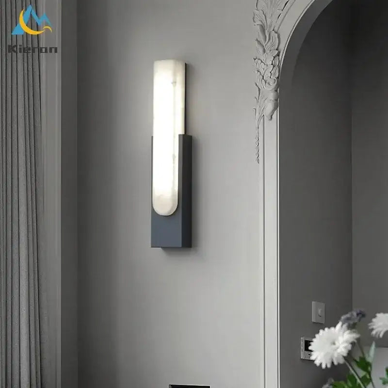 Modern gold cloud stone led wall light with a sleek matte black base and frosted glass panel for bedroom decorbites cloud stone