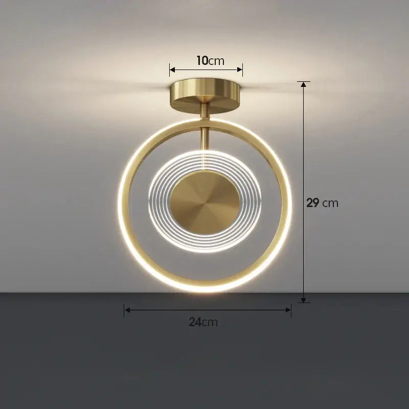 Modern gold-toned ceiling light with concentric led rings and brushed metal finish for decorbites led ceiling use