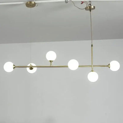 Modern brass decorbites copper ceiling chandelier with five frosted glass globe bulbs for living room lighting