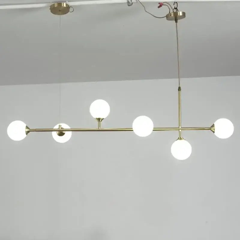 Modern brass decorbites copper ceiling chandelier with five frosted glass globe bulbs for living room lighting