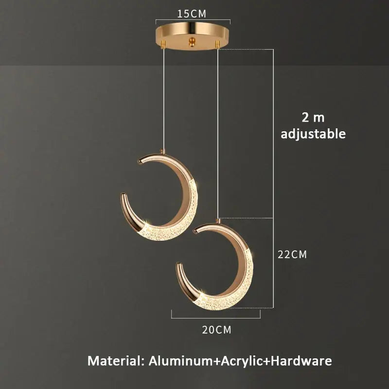 Modern gold crescent pendant light with sparkling acrylic finish and adjustable 2 meter hanging length for dining settings