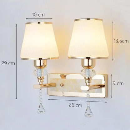 Modern gold crystal bedside wall sconce with cream fabric shades and decorbites crystal bedside droplets for bedroom light