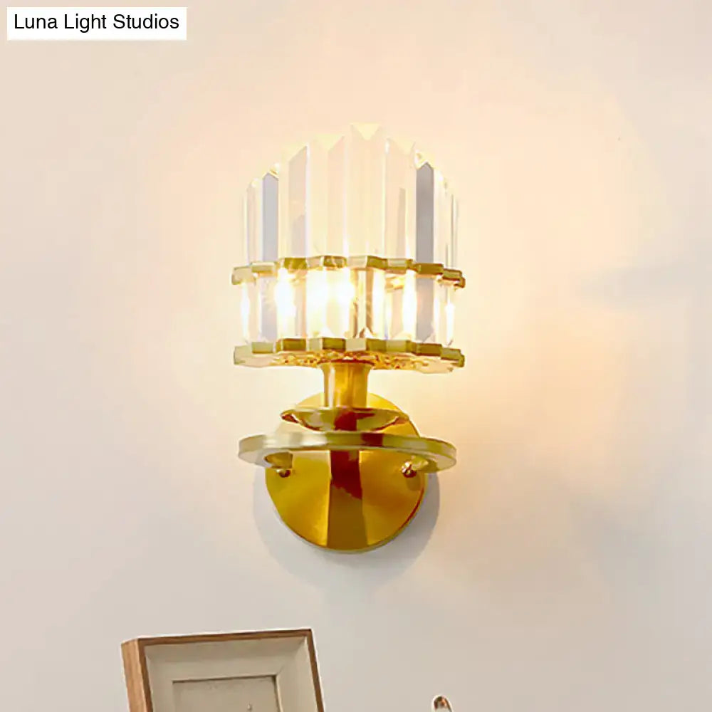 Gold-toned wall lamp with stacked faceted crystal block tiers designed for modern living room lighting sconce