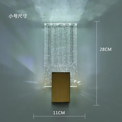 Modern wall lamp with a clear sparkling glass body and gold decorbites crystal brass led base for luxury decor