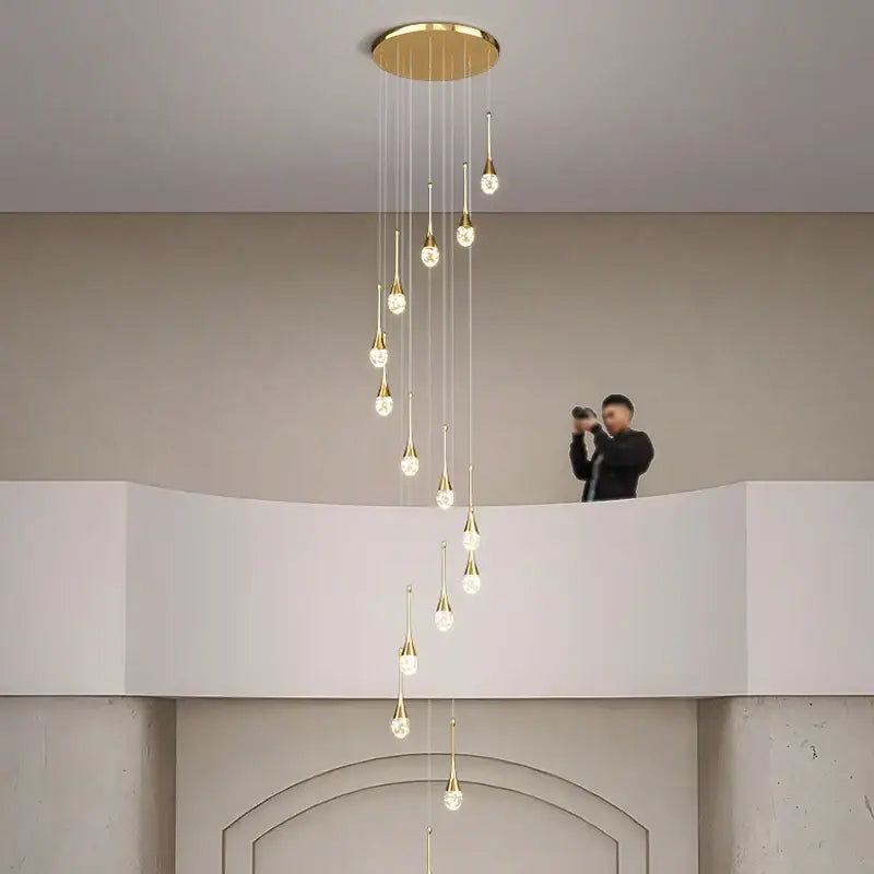 Gold-toned decorbites crystal bubble chandelier with multiple teardrop pendants for modern dining room decor