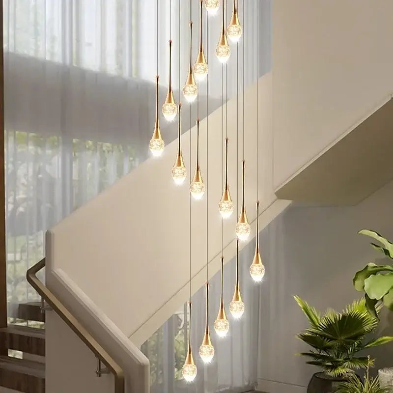 Modern gold crystal bubble chandelier with teardrop glass shades in a cascading design for living room decorbites crystal bubble