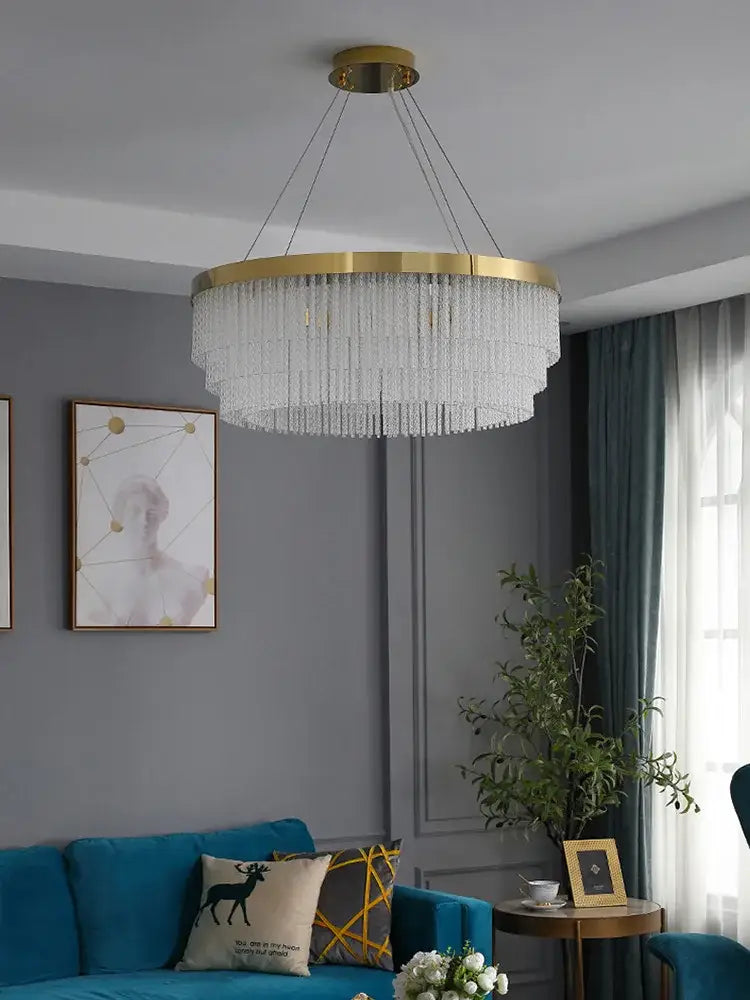 Modern gold crystal ceiling chandelier with a circular frame and cascading clear strands pendant light for dining room decorbites crystal ceiling