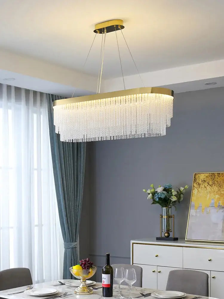 Modern gold crystal ceiling chandelier with rectangular frame and cascading clear crystal strands pendant light for dining room decorbites