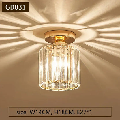 Modern gold crystal ceiling pendant light with gold-toned metal base and clear faceted glass panels for living room