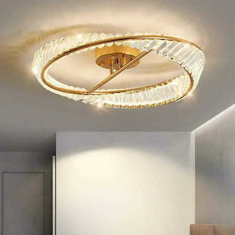 Modern gold crystal ceiling pendant light featuring two concentric rings with faceted crystals for living room use