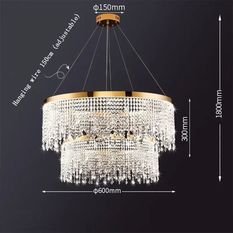 Modern gold crystal chandelier lighting fixture with two-tiered metal frame and cascading clear crystals by decorbites