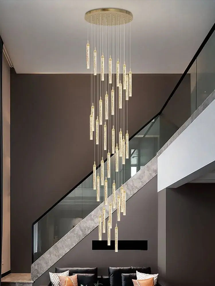 Elegant gold crystal chandelier with cascading cylindrical glass elements for luxury dining room decorbites crystal chandelier