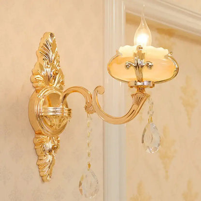 Modern gold crystal droplet wall mount light with ornate gold finish crystal pendants and frosted glass shade for bedroom