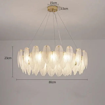 Modern gold crystal feather chandelier with translucent leaf-shaped glass panels and gold-toned metal accents by decorbites crystal