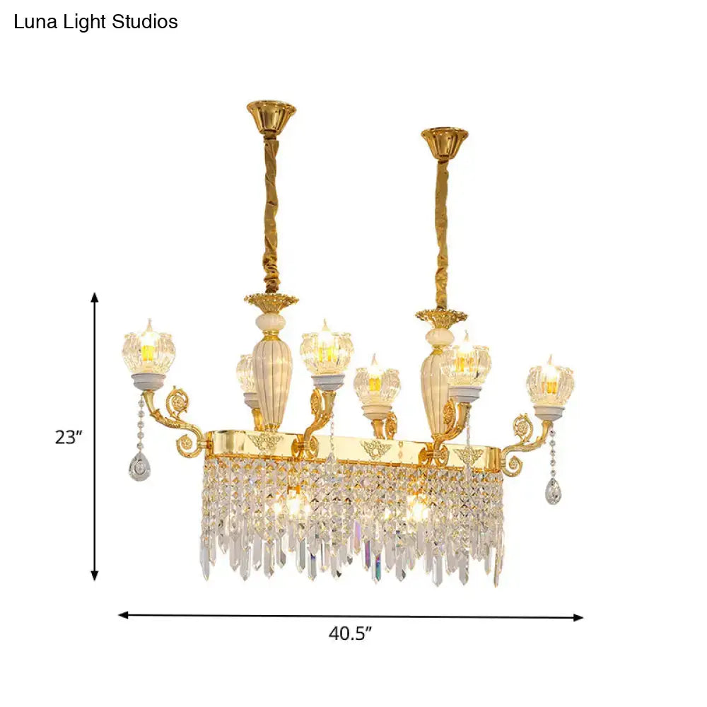 Gold-toned decorbites crystal floral island pendant lamp with ornate arms and candle-style bulb base dining room light fixture