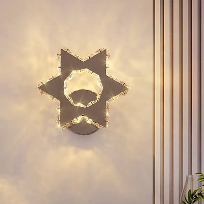 Modern gold crystal flower wall sconce with sleek chrome finish and warm white light for 110v-120v bedroom use