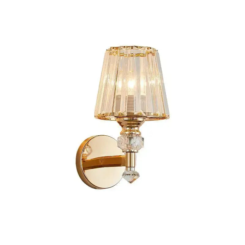 Modern gold wall lamp with decorbites crystal glass faceted shade and dangling clear crystals for luxury bedroom decor