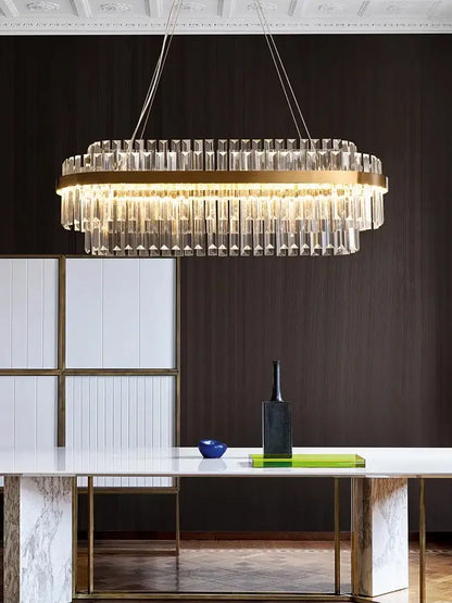 Modern gold crystal hanging lamp with a circular frame and clear crystal prisms perfect for living room decorbites crystal hanging