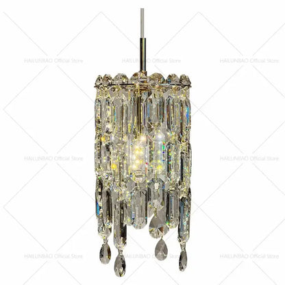 Modern gold decorbites crystal headboard chandelier with cascading faceted prisms and sleek metallic frame for master bedroom