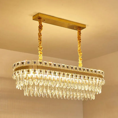 Gold-toned rectangular decorbites contemporary island light with cascading crystal droplets suitable for 110v-120v and 220v-240v