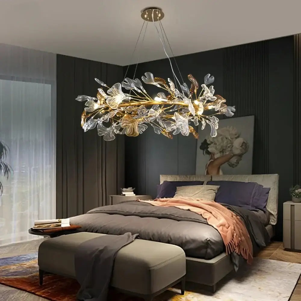 Modern gold crystal leaf branch chandelier with a metallic frame and translucent glass leaves for dining room decorbites crystal leaf