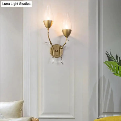 Modern gold crystal leaf wall sconce with gold finish, crystal leaf design, two upward glass shades for bedroom lighting