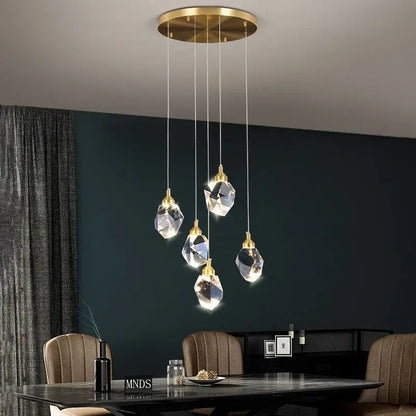 Modern gold crystal led ceiling chandelier featuring five faceted clear glass pendants for dining room decorbites crystal led