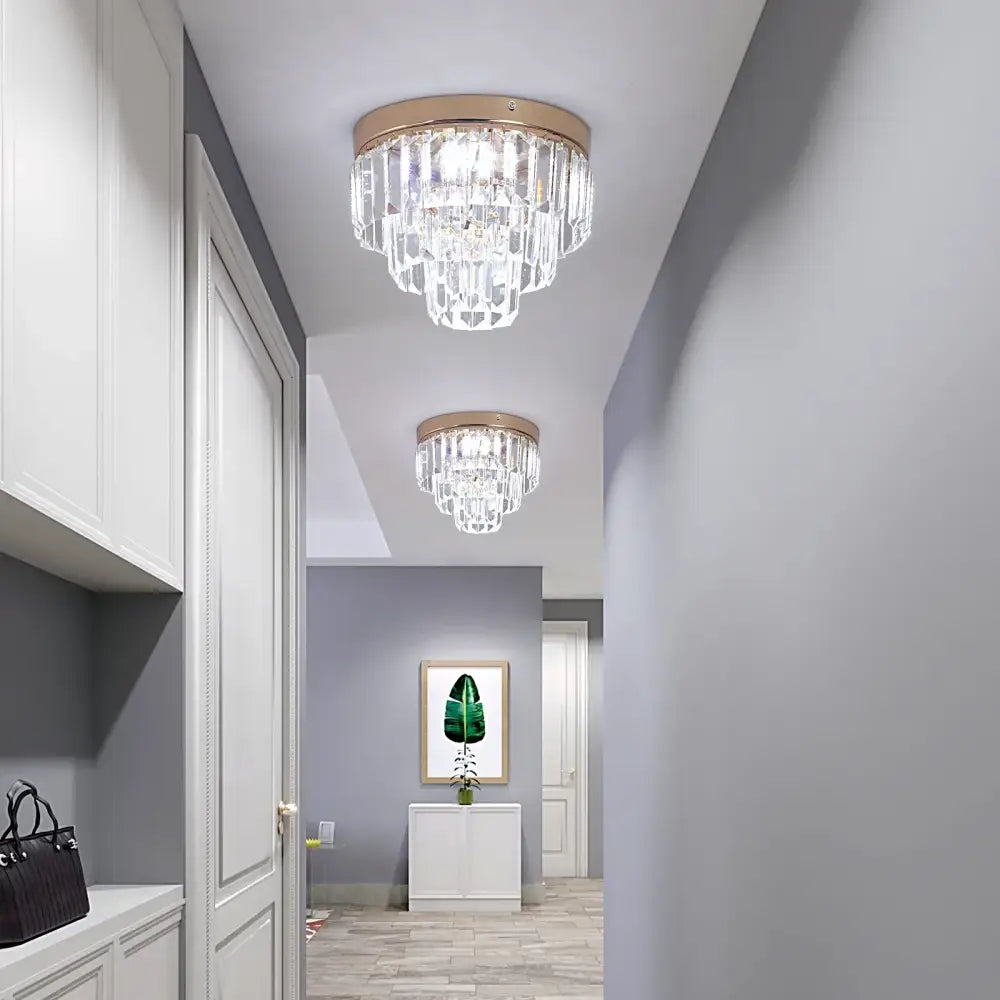 Modern gold crystal led ceiling chandelier with circular frame and cascading clear crystal prisms for dining room