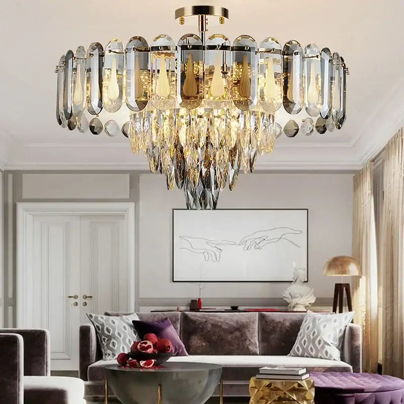 Modern gold crystal led ceiling chandelier with a gold metal frame and cascading clear and amber crystal pendants decorbites crystal led