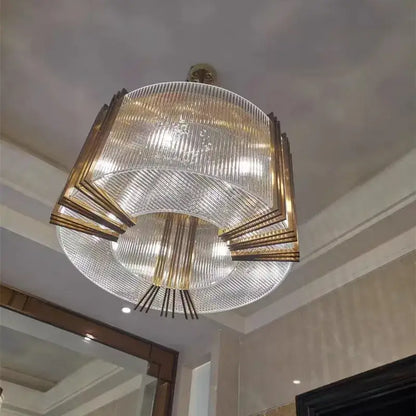 Modern gold crystal led chandelier with clear ribbed glass panels and gold metal accents for dining room decorbites crystal led
