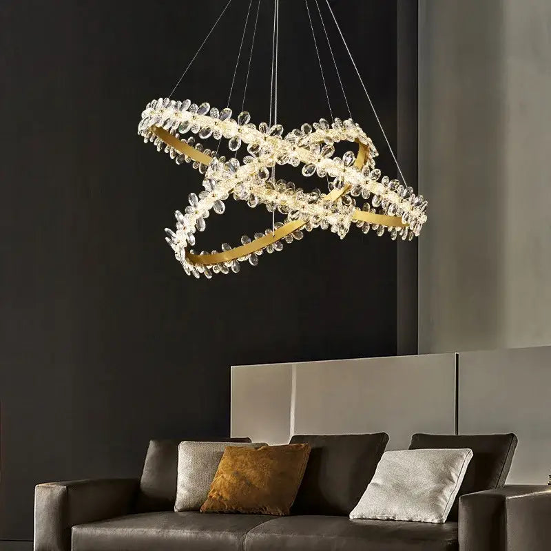 Modern gold crystal led chandelier featuring intertwined circular frames with clear crystal droplets for dining room decorbites crystal led chandelier