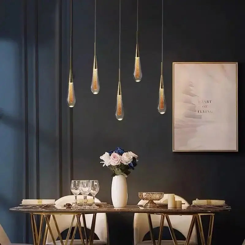 Five elegant gold crystal led teardrop pendant lights with glitter-filled clear glass for modern dining room decorbites chandelier