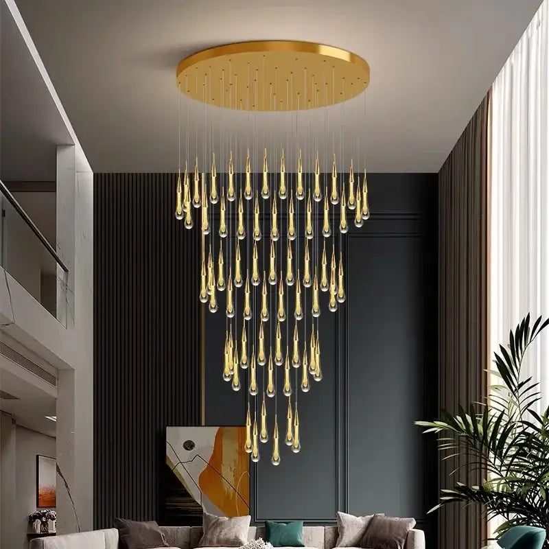 A modern gold crystal led crystal led chandelier pendant light with cascading teardrop glass pendants for dining room decor