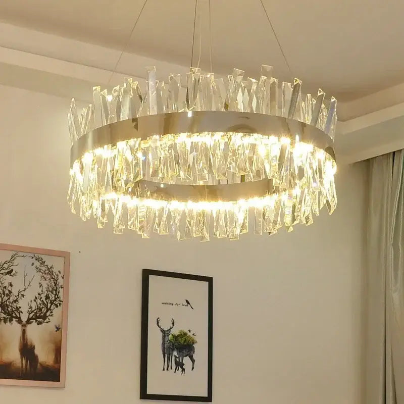Modern gold crystal led pendant chandelier with sleek metallic frame and cascading clear crystal shards for dining room decorbites crystal led chrome