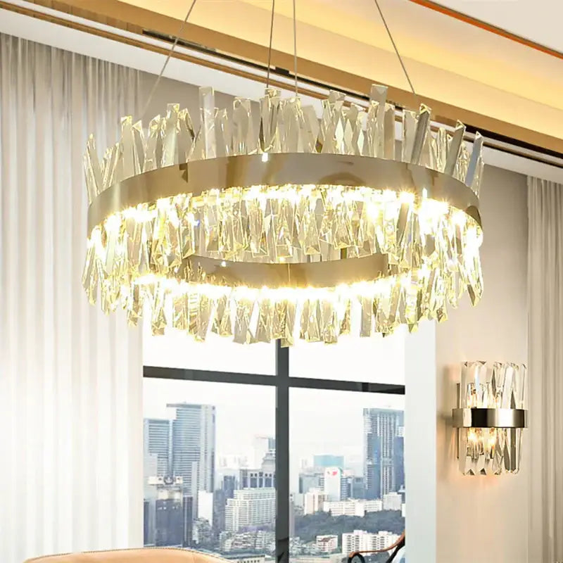 Modern gold crystal led pendant light with a circular metal frame and cascading clear crystals by decorbites pendant light