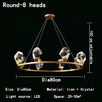 Modern gold crystal led pendant lights featuring a gold-toned circular chandelier with eight faceted crystal led pendant lights suspended by wires