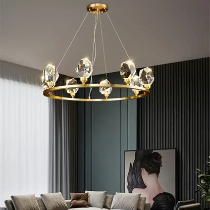 Modern gold crystal led pendant lights feature a gold-toned circular chandelier with faceted crystal pendants for dining room