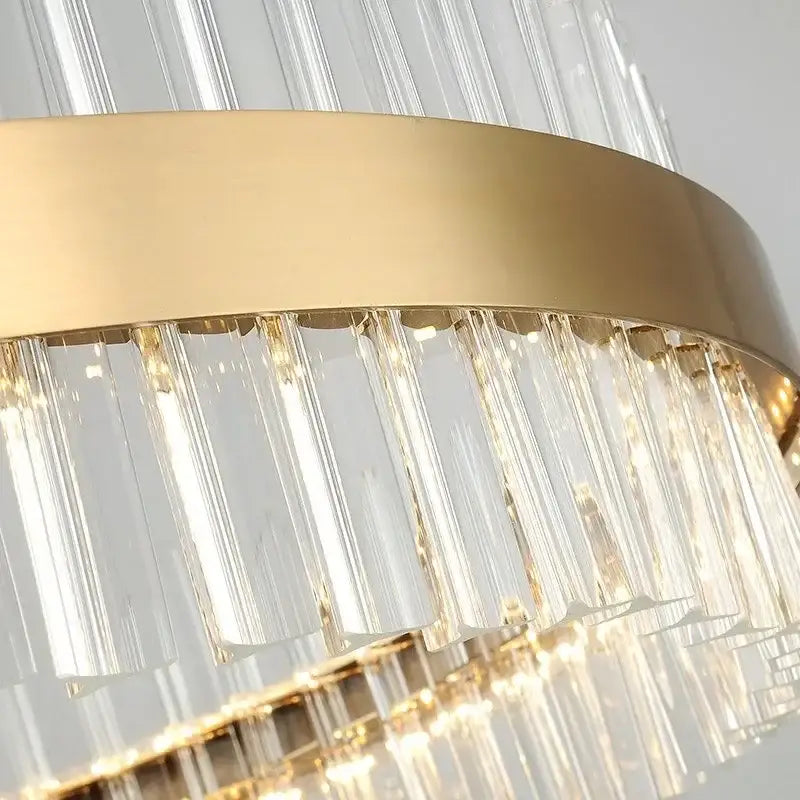 Modern gold crystal led ring chandelier featuring clear vertically oriented crystal prisms for dining room lighting decorbites crystal led